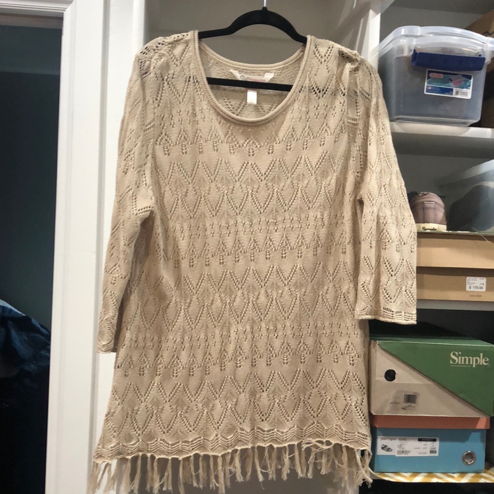 Cute top, only worn once.  Does need a cami underneath.